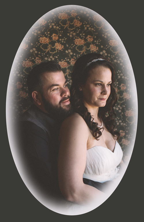 Emily & Wade in front of the Rose Wall inside Lynde House