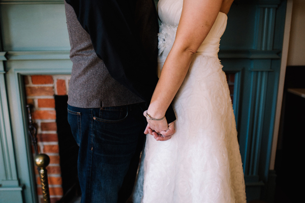 Holding hands forever... photograph in front of one of the fireplaces at Lynde House.